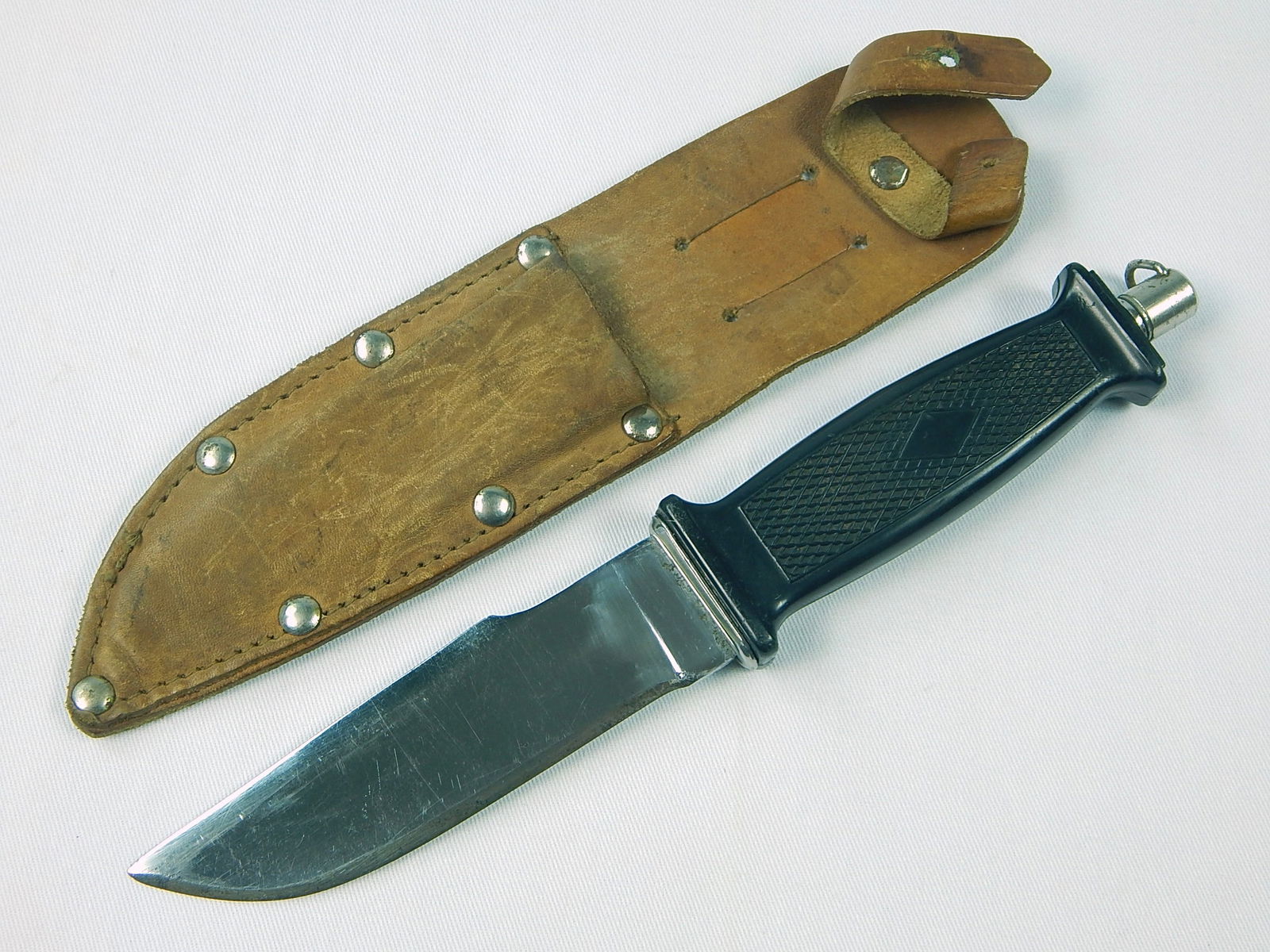 Soviet Russian USSR Army Paratrooper's Knife: Vintage Soviet Russian Army Paratrooper's Knife with Leather Sheath. Solid. 9 5/8" long with 4 3/4" blade. Sheath doesn't close. LiveAuctioneers is currently displaying only it's own expensive shippin