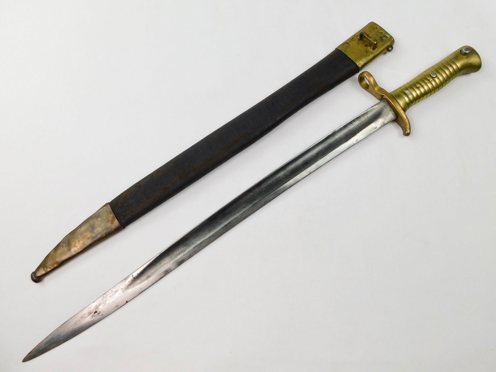 RARE South American Antique pre WW1 Bayonet Knife: RARE South American pre WW1 Bayonet with Scabbard. Push button works. 25 5/8" total length. The blade is 18".LiveAuctioneers is currently displaying only it's own expensive shipping options. However,