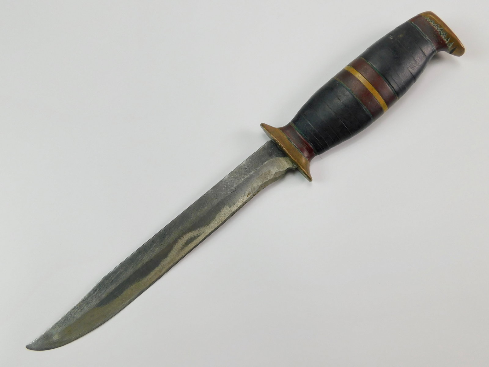 US WW2 Vintage Theater Custom Handmade Fighting Knife: US WW2 Theater Custom Handmade Fighting Knife. No sheath. The knife is solid, no loose parts. Size: 11 5/8" total length, the blade is 7 1/4".LiveAuctioneers is currently displaying only it's own expe