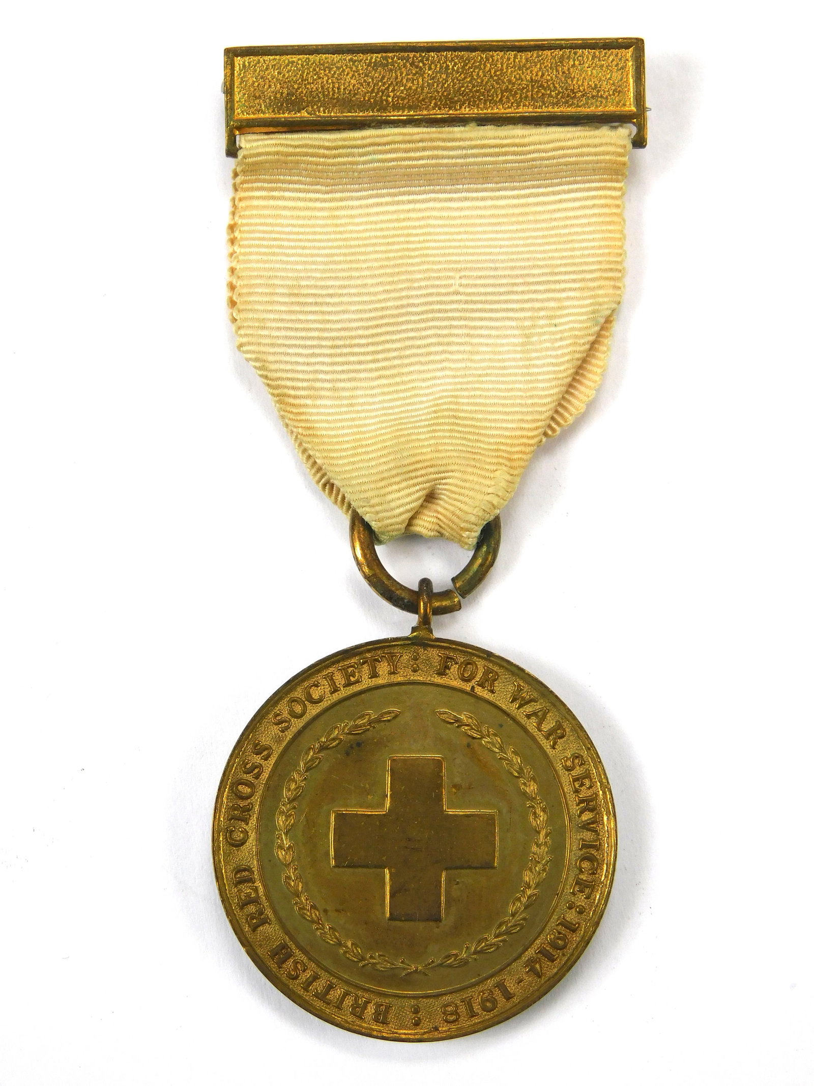 British Red Cross Society WW1 War Service Medal 1914-1918 Inter Arma Caritas: In-House Shipping. British Red Cross Society War Service Medal issued for voluntary service during the First World War 1914–1918. Front shows raised cross within laurel wreath. Reverse inscribed