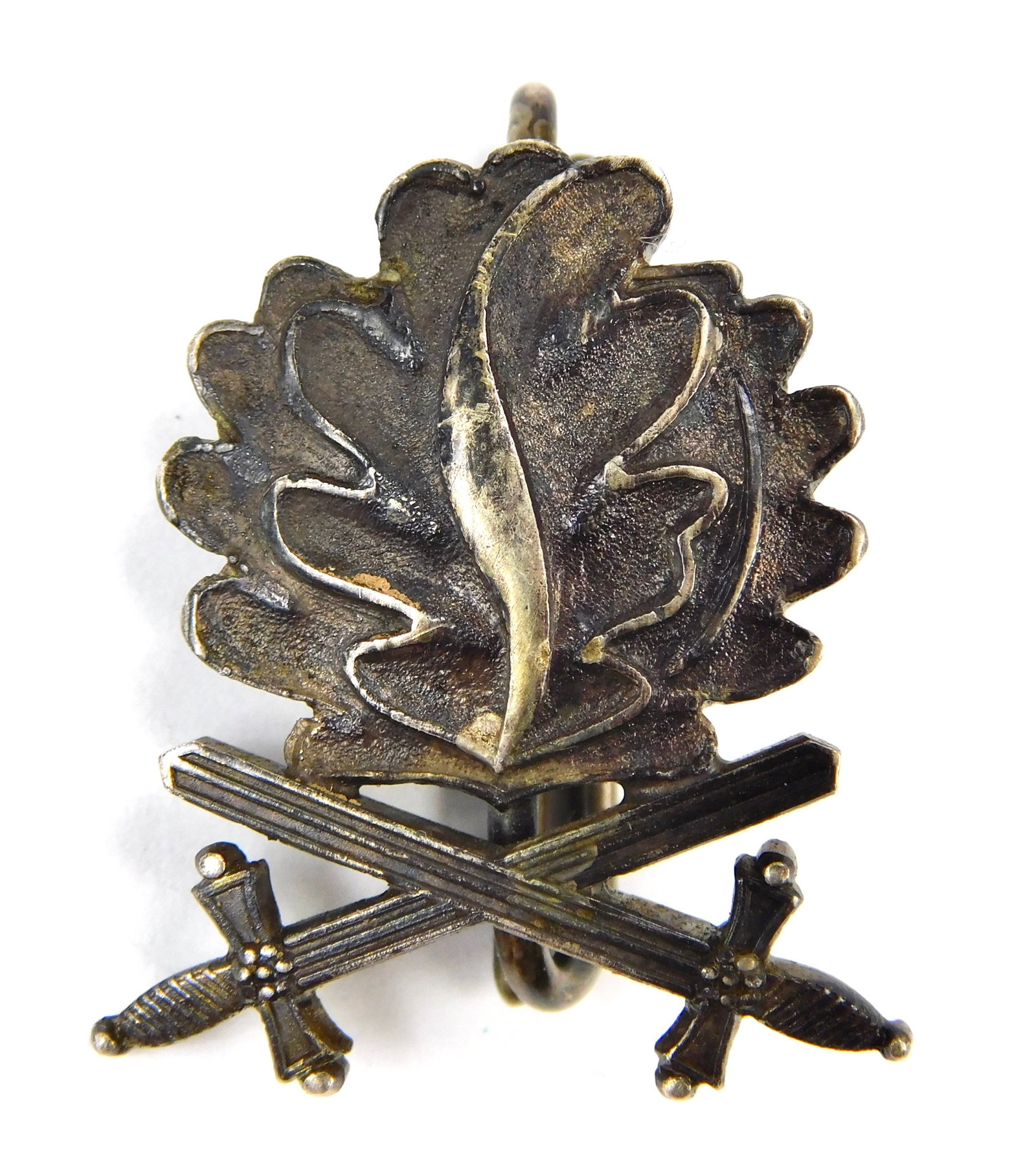 German WW2 Knights Cross Oak Leaves w/ Swords Silver Marked 900 Pin Badge: In-House Shipping. Original German WW2 Oak Leaves with Swords Badge for the Knight’s Cross of the Iron Cross, constructed in silver and marked “900” with maker hallmark on the revers
