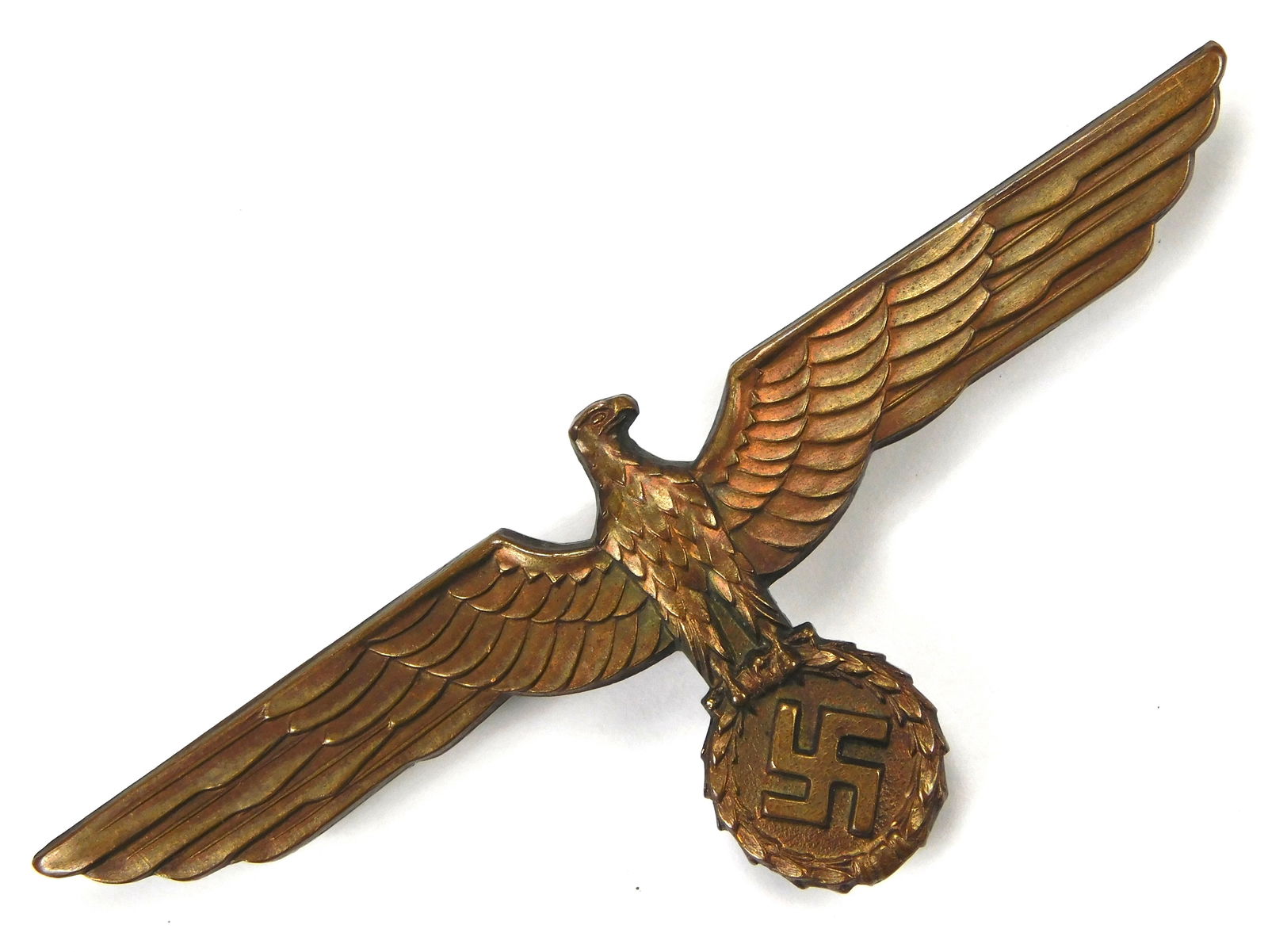 German WW2 NSDAP Political Leader Bronze Metal Breast Eagle Pinback: In-House Shipping. German WW2 NSDAP political leader breast eagle bronze metal pinback, long horizontal pin, wreath swastika center. Worn on political leader and SA/NSKK dress tunics.