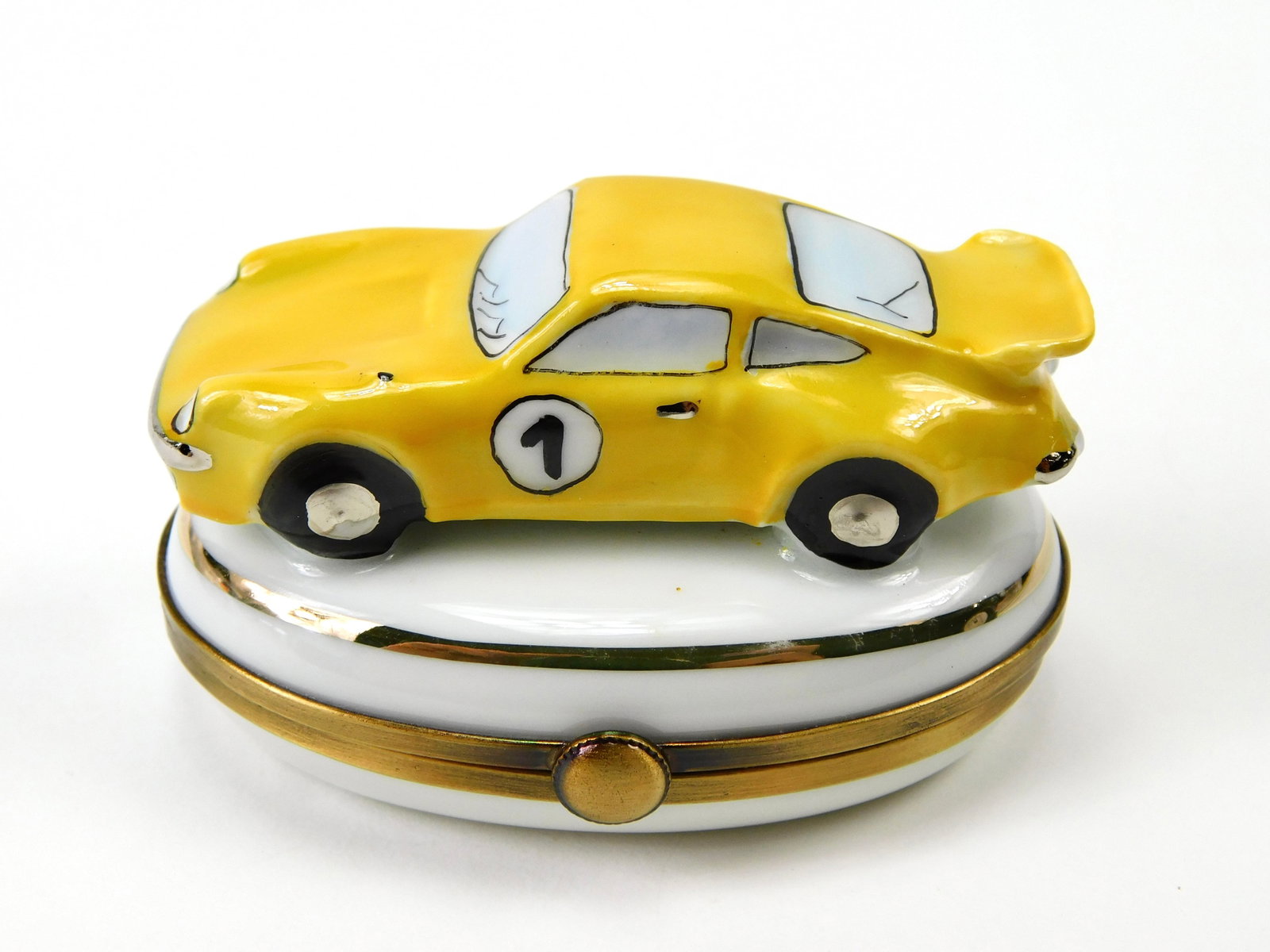 Pierre Limoges France Yellow Sports Car Racing No 1 Porcelain Trinket Box: In House Shipping. Pierre Limoges France hand-painted porcelain trinket box modeled as a yellow sports car with racing details. The dimensional car features a bright yellow body, rear spoiler, black t