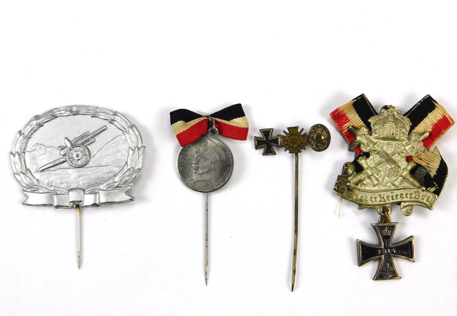WWI Imperial German 4pc Veteran Medal Stickpin & Badge Grouping: In House Shipping. Group of four Imperial German military and veteran-related medal, stickpin and badge pieces. Lot includes a field artillery-themed stickpin with cannon within a wreath, a portrait m