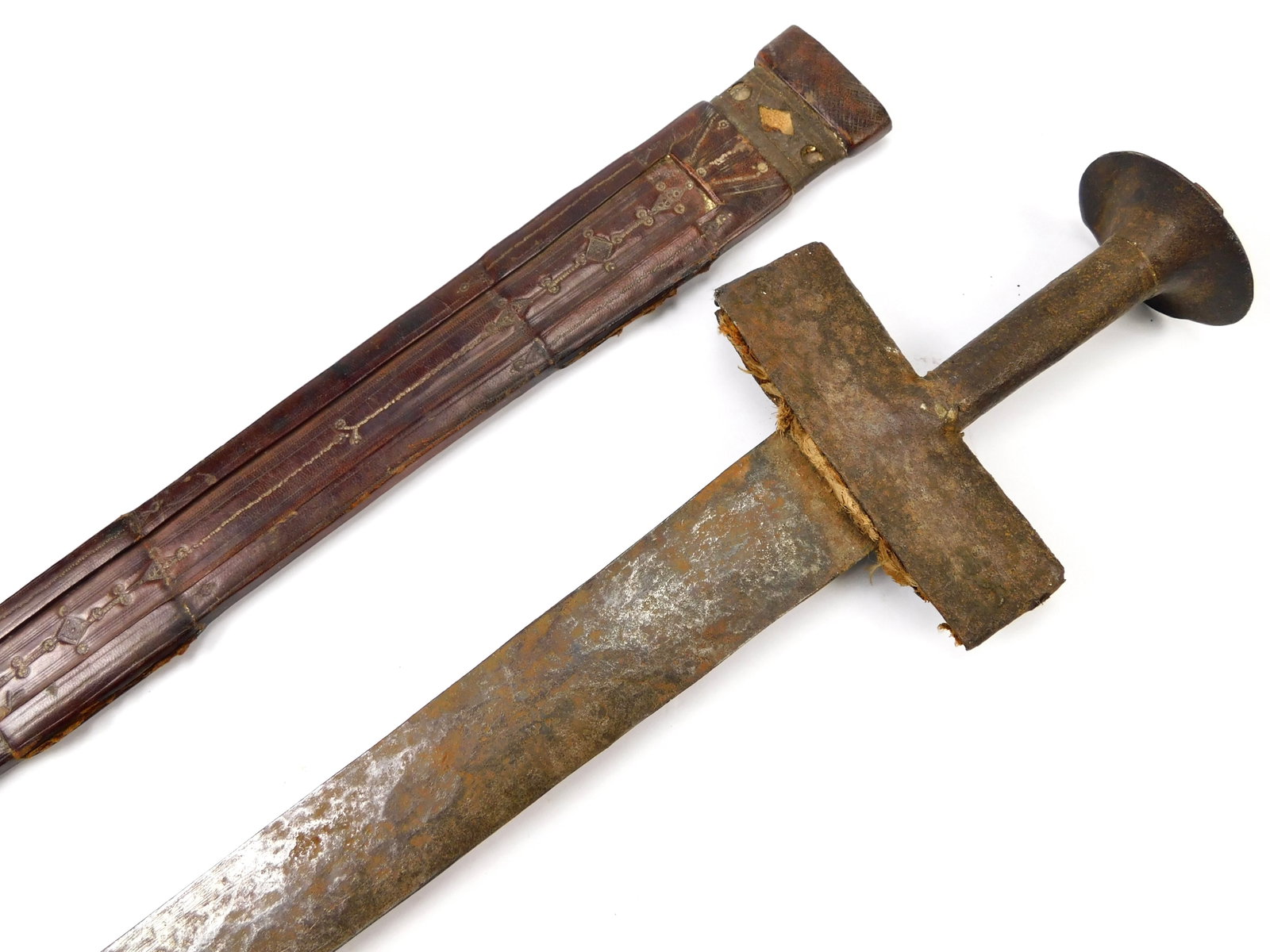 Antique Takuba Takouba Takoba Africa African 19 Century Sword & Scabbard: Antique African 19 Century Takuba Sword with Leather Scabbard. Scabbard's leather is dry, doesn't cover the blade. Guard is loose. 37 1/2" long with 32" blade.