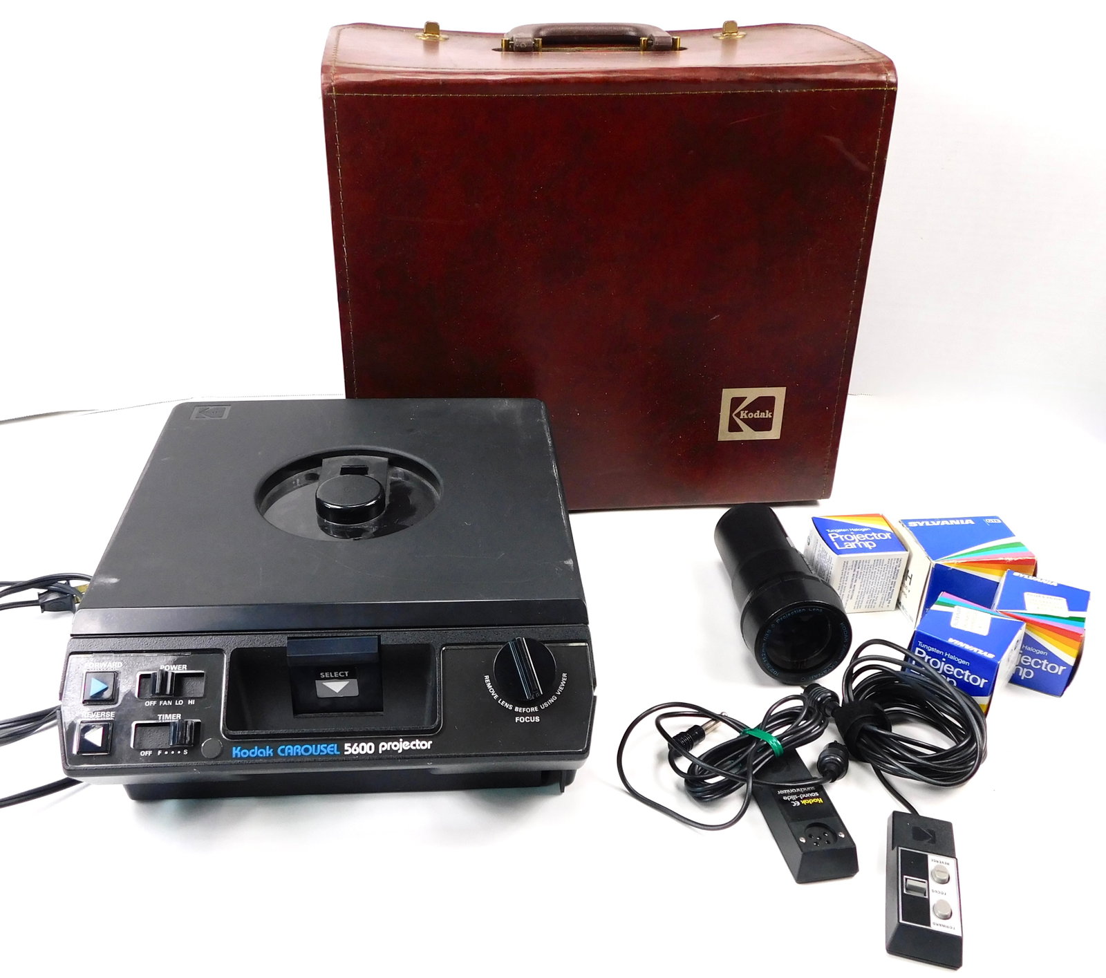 Vintage Kodak Carousel 5600 Slide Projector Zoom Lens Remote Lamps Hard Case: In House Shipping. Vintage Kodak Carousel 5600 slide projector outfit with Kodak Zoom Ektanar C 102mm to 152mm f/3.5 projection lens, wired remote control, Kodak EC Sound Slide Synchronizer, four boxe