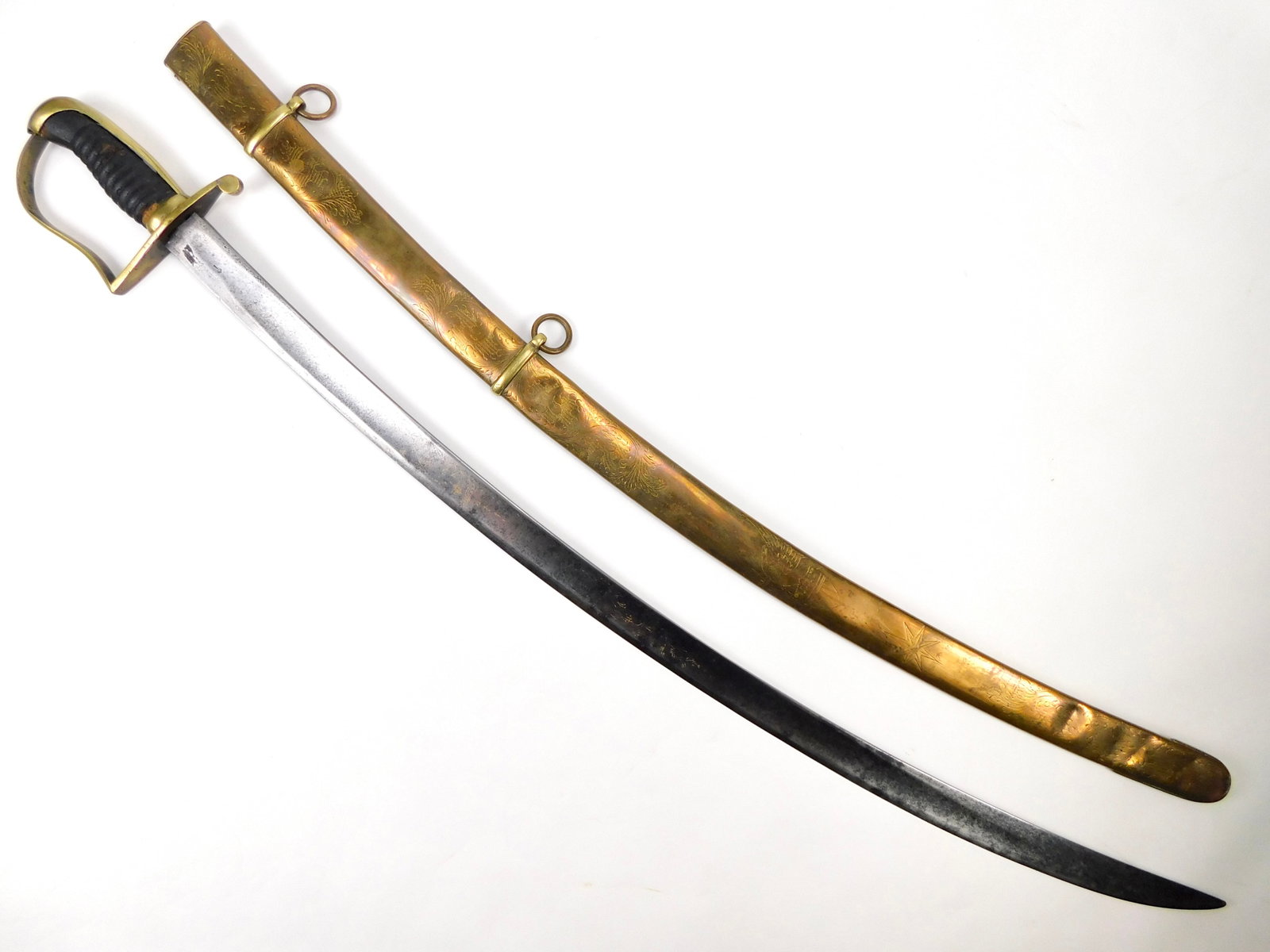 US Civil War Antique Gold Engraved Cavalry Officer's Sword w/ Scabbard: US Civil War Cavalry Officer's Sword with Scabbard. Hilt is loose. 35 1/4" total length. The blade is 30 5/8".