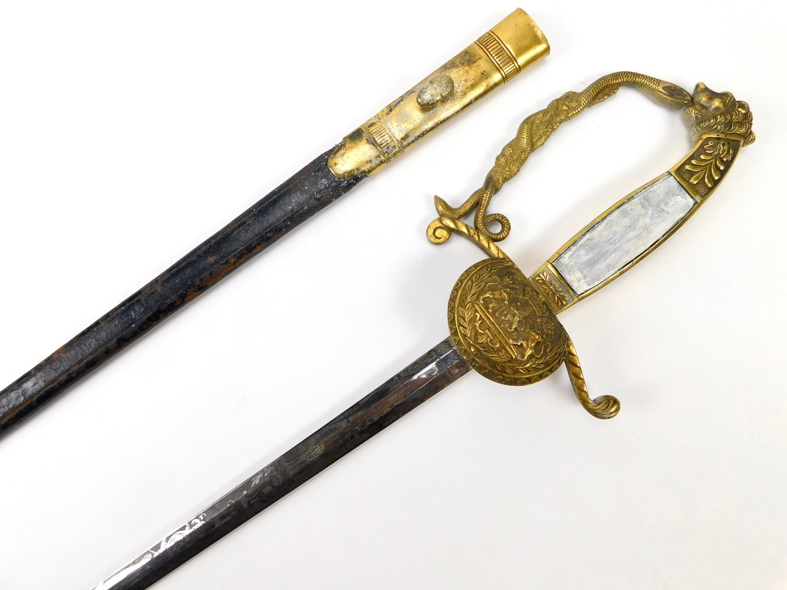 German Germany Bavarian WW1 Antique Engraved Lion Head Court Sword w/ Scabbard: German Bavarian WW1 Engraved Lion Head Court Sword with Scabbard. The hilt is a bit loose. One of the mother-of-pearl handle plates is missing and replaced with white painted wood. 37" total length. T