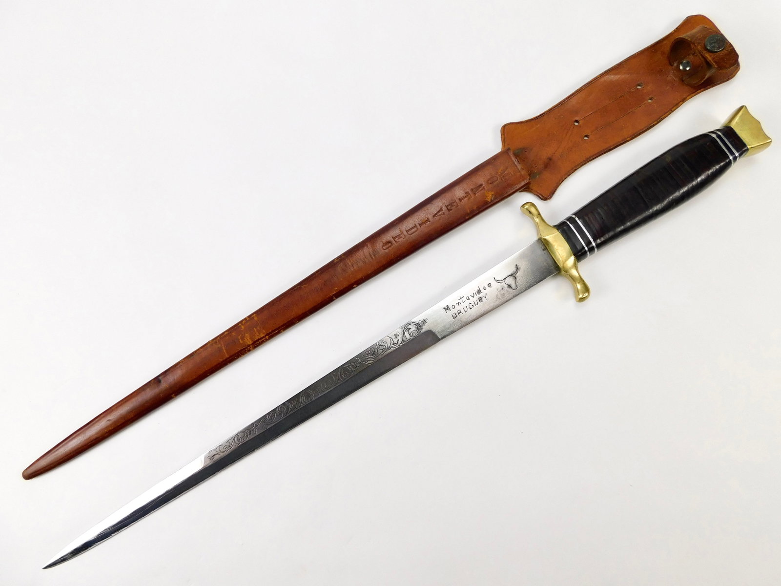 Vintage WW2 Period Custom Made Uruguay Dagger Knife Engraved Sword Blade: Vintage WW2 Period Custom Made Uruguay Dagger with Scabbard. Engraved sword blade. 21 1/2" total length. The blade is 15 3/4".
