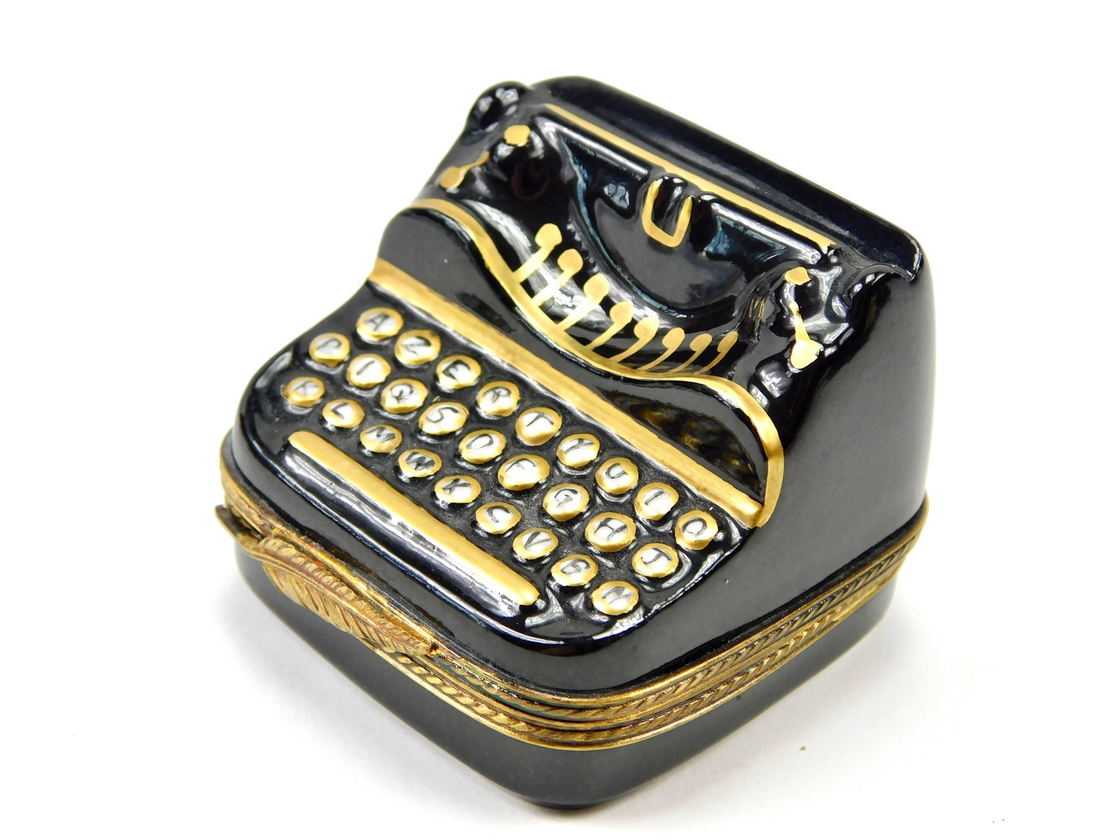 Limoges France Vintage Typewriter Porcelain Trinket Box Black Gold S.J.: In House Shipping. Limoges France hand-painted porcelain trinket box modeled as a vintage manual typewriter. The dimensional design features a glossy black finish with gold-tone accents along the carr