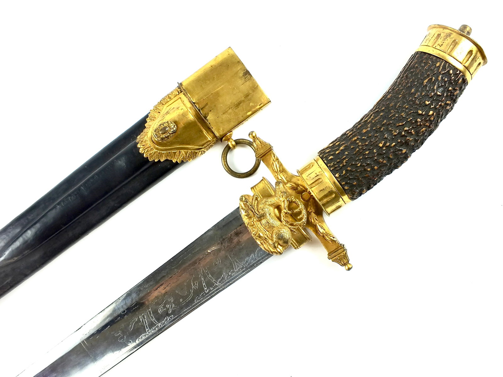 Antique Germany German 19C Large Engraved Hunting Sword: German 19 Century Large Hunting Sword with Scabbard. Handle parts are little loose. The bottom fitting of the scabbard is possibly replaced. 30 7/8" total length. Blade is 24".
