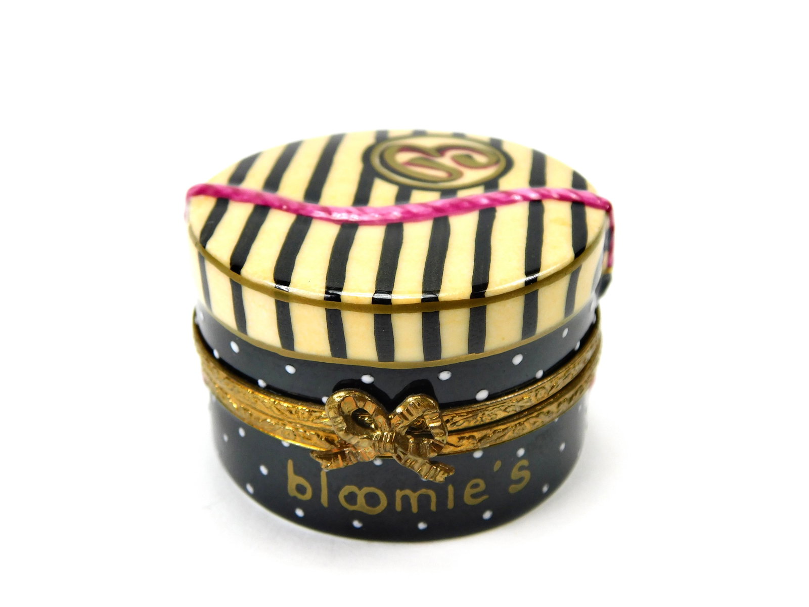 Limoges France Bloomie's Bloomingdale's Porcelain Trinket Box Limited 18/250: In House Shipping. Limoges France hand-painted porcelain trinket box designed for Bloomingdale's, featuring cream and black stripes with a raised pink ribbon and stylized B emblem on the lid. The lowe