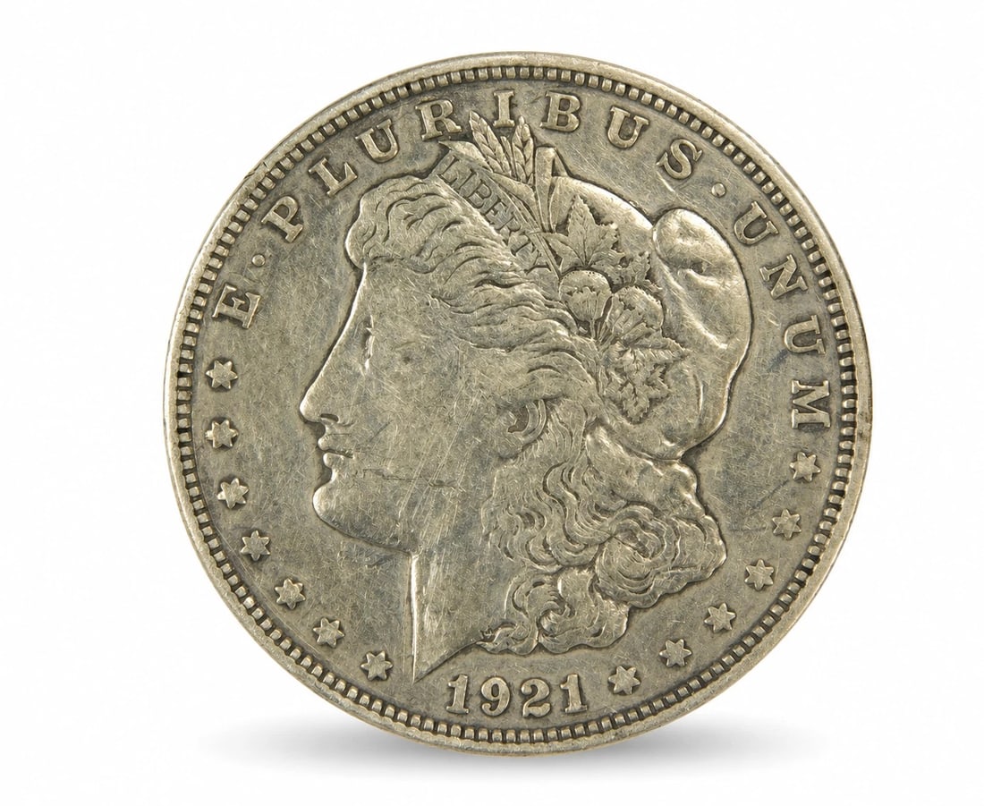 1921-D Morgan Silver Dollar Denver Mint 90% Silver US Coin: In-House Shipping. 1921-D Morgan Silver Dollar, struck at the Denver Mint. Classic United States silver dollar designed by George T. Morgan, featuring the Liberty portrait on the obverse and the Ameri