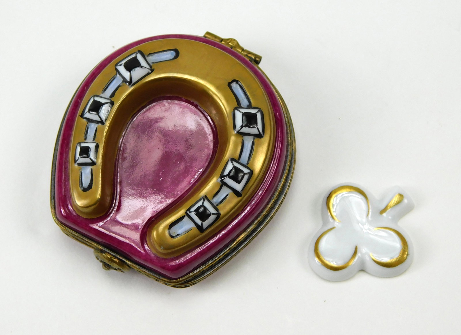 Charmant Limoges France Good Luck Horseshoe Porcelain Trinket Box Clover: In House Shipping. Charmant Limoges France hand-painted porcelain trinket box modeled as a horseshoe. The box features a glossy mauve-pink finish with a raised metallic gold-tone horseshoe design acce