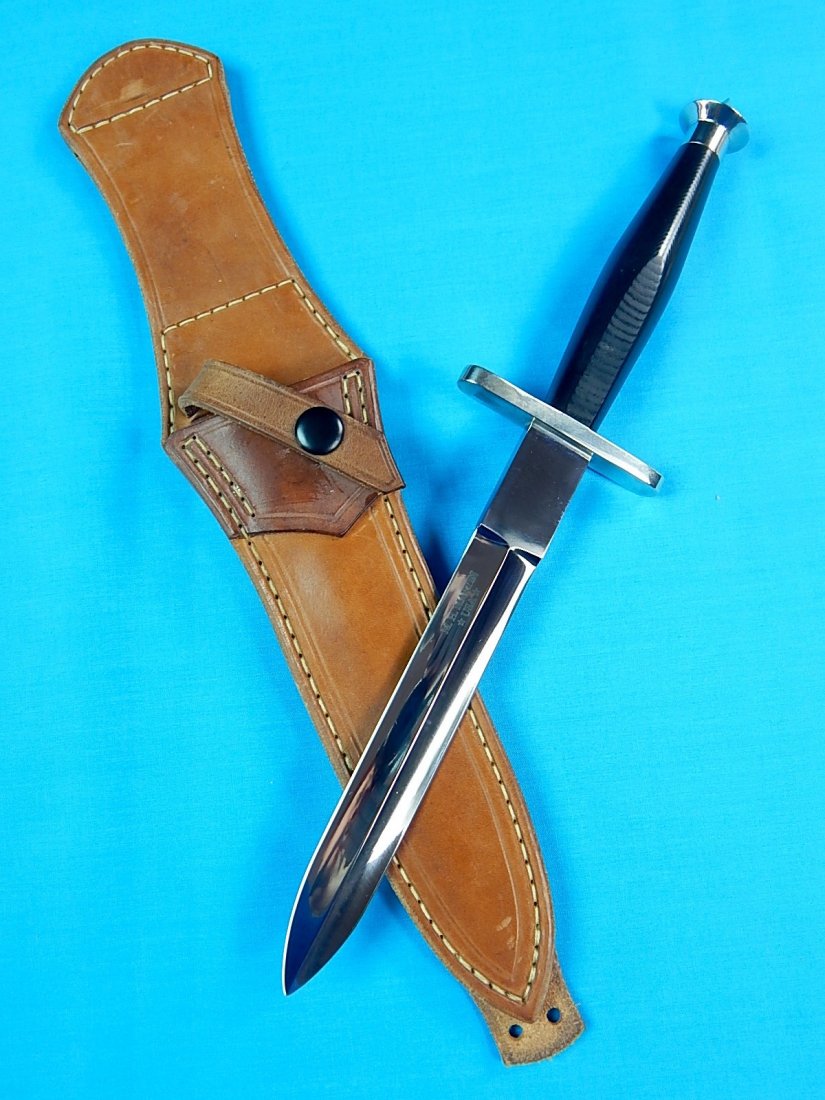 Custom Hand Made M. H. MARTIN Stiletto Fighting Knife: NO BUYER"S PREMIUM! (BUYER"S PREMIUM 0%).Custom Hand Made M.H. MARTIN V-42 Style Commando Stiletto Fighting Knife with original Jim Layton leather sheath. Size: 12 5/8" with 7 1/4" blade.We accept pay
