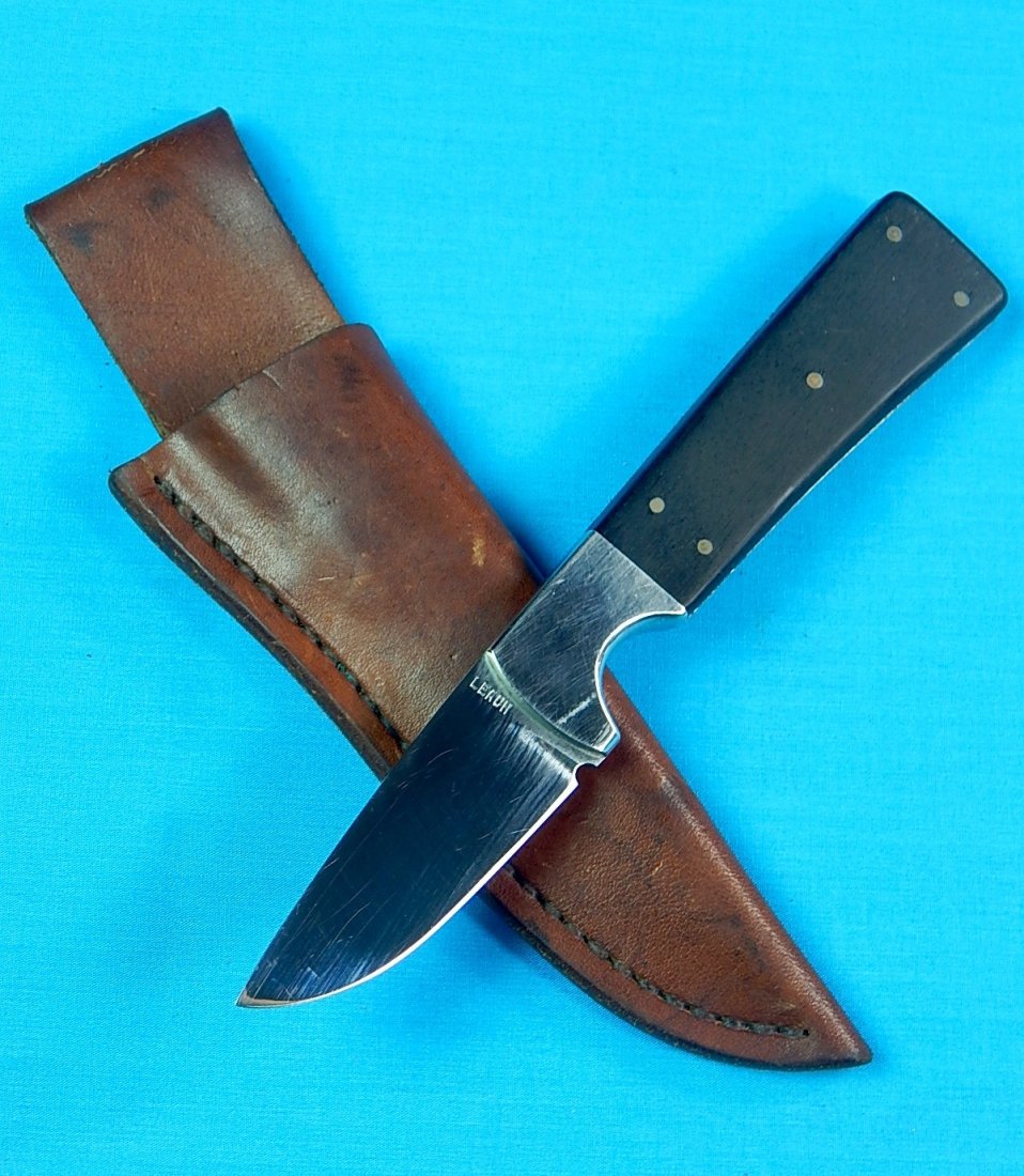 1970's Custom Made MIKE MICHAEL LEACH Hunting Knife: NO BUYER"S PREMIUM! (BUYER"S PREMIUM 0%).Vintage US 1970's Custom Hand Made MIKE MICHAEL LEACH Small Hunting Knife. With leather sheath. Size: 7 1/2" long with 3 7/8" blade.We accept payment by check 