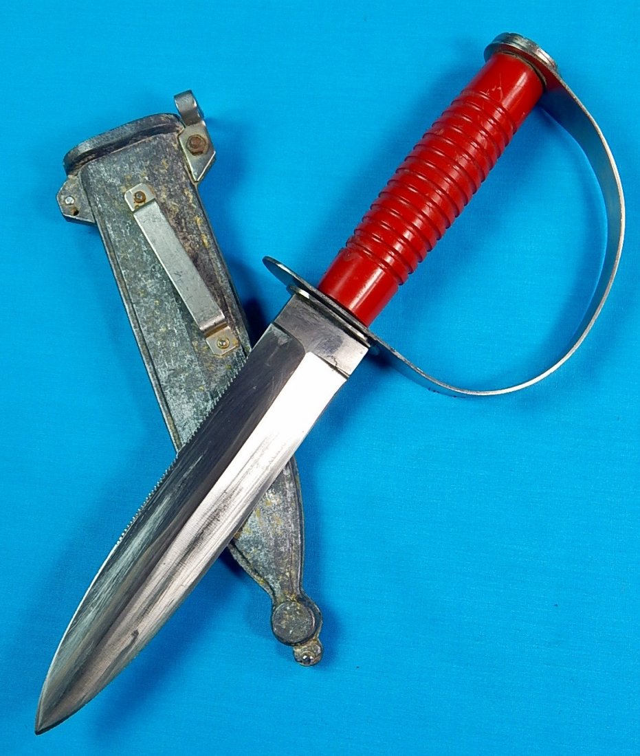 RARE FROGMAN German Germany PUMA WERK Diving Knife: NO BUYER"S PREMIUM! (BUYER"S PREMIUM 0%).RARE Vintage FROGMAN German Solingen PUMA-WERK Diving Knife with original scabbard. Rotating guard. Size: 12" long with 7 1/4" blade.We accept payment by check