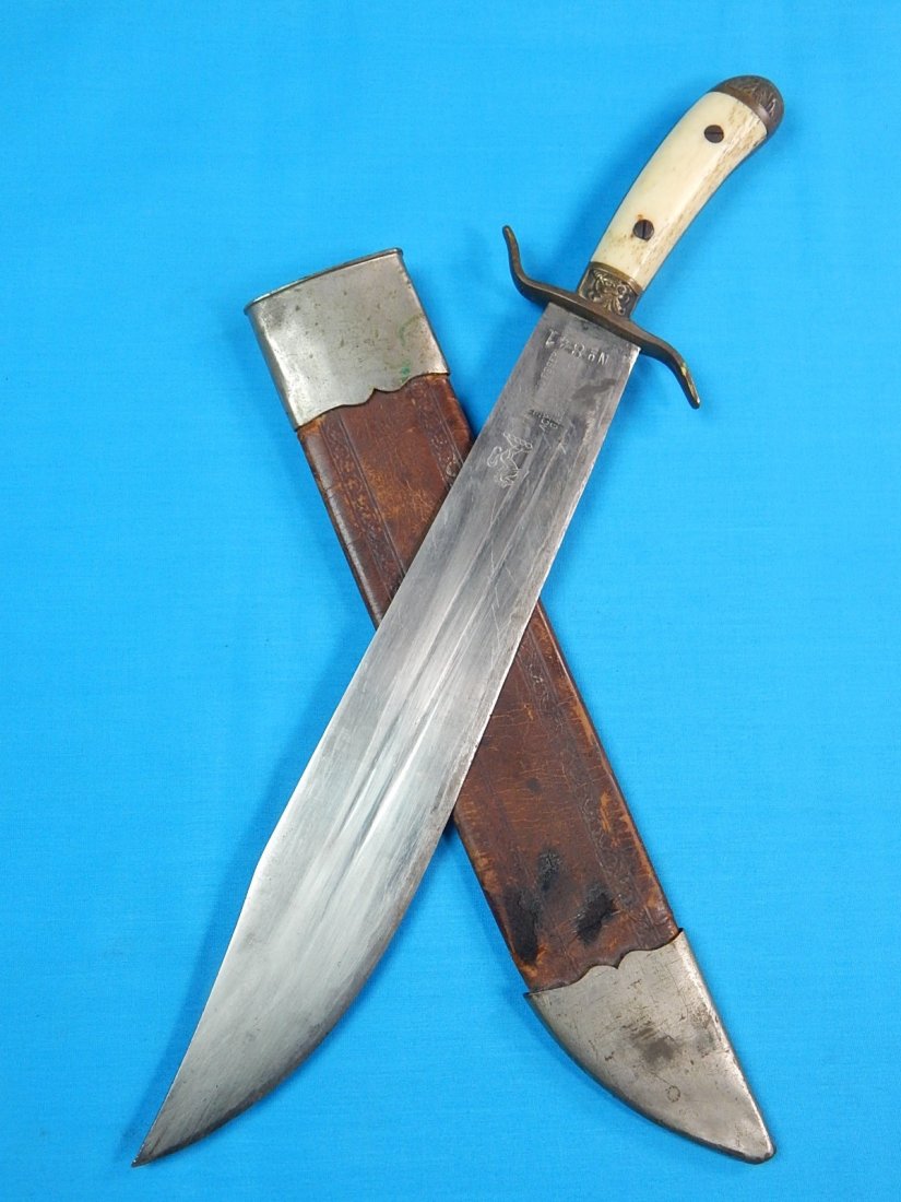 Antique Spanish South American FERNANDO ESSER Knife: NO BUYER"S PREMIUM! (BUYER"S PREMIUM 0%).Antique Spanish or South American FERNANDO ESSER Huge Fighting Knife with Scabbard. Ox bone handle. Size: 16 3/4" long with 12 1/8" blade.We accept payment by 
