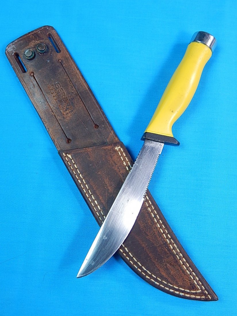 RARE GERBER USA Yellow Handle Diving Diver Knife: NO BUYER"S PREMIUM! (BUYER"S PREMIUM 0%).RARE GERBER USA Yellow Handle Diving Diver Diver's Knife with original leather sheath. Size: 10 7/8" long with 6" blade.We accept payment by check or money ord
