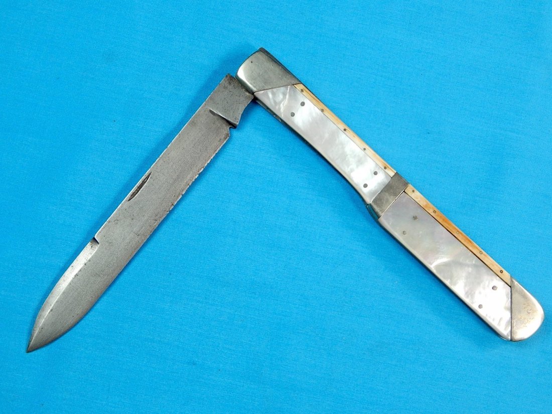 Antique French Italian Huge Folding Pocket Knife: NO BUYER"S PREMIUM! (BUYER"S PREMIUM 0%).Antique French or Italian Huge Folding Pocket Knife. Mother of pearl handle. Unmarked. Size: 13 1/4" long, 7 1/4" closed. The blade is 6 1/8".We accept payment