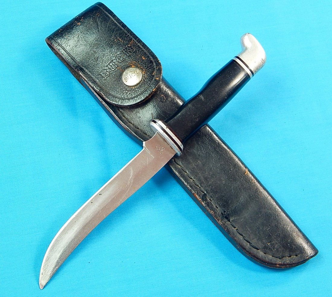 1973-85's BUCK Fisherman Model 121 Hunting Knife: NO BUYER"S PREMIUM! (BUYER"S PREMIUM 0%).US 1973-85's BUCK Fisherman Model 121 Hunting Knife with leather sheath. Size: 9 1/2" long with 5 3/8" blade.We accept payment by check or money orders.Pay Pal