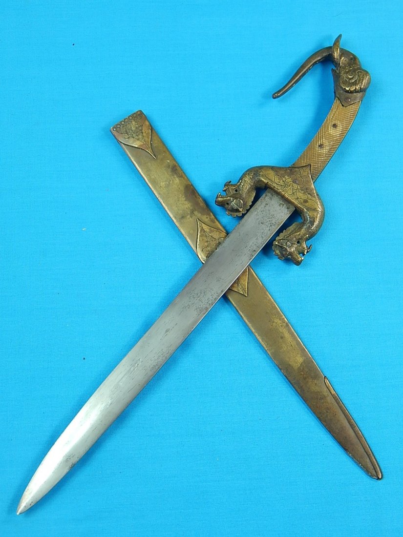 Antique Chinese Japanese Elephant Head Dagger Knife: NO BUYER"S PREMIUM! (BUYER"S PREMIUM 0%).Antique Chinese or Japanese Elephant Head Dagger with Scabbard. Carved ox bone handle. Guard and scabbard look like copper. Size: 16 1/8" long with 11" blade.W
