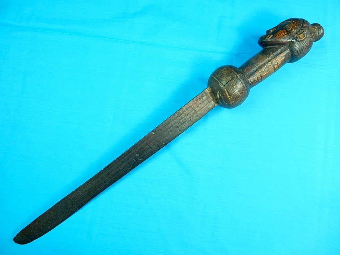 Antique Africa African Carved Handle Short Sword Knife: NO BUYER"S PREMIUM! (BUYER"S PREMIUM 0%).Antique African 19 Century Short Sword / Huge Knife. No sheath. Carved wood handle. Size: 26" long with 17" blade.We accept payment by check or money orders.Pa