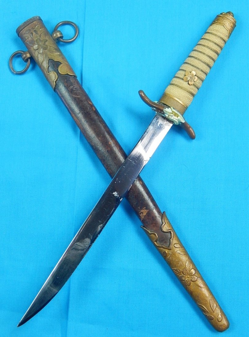 Japanese Japan WW2 Late War Navy Officer's Dagger Knife: NO BUYER"S PREMIUM! (BUYER"S PREMIUM 0%).Original Japanese WW2 Late War Navy Officer's Dagger with Scabbard.12 3/8" total length. The blade is 8 1/8". We accept payment by check or money orders.Pay Pa
