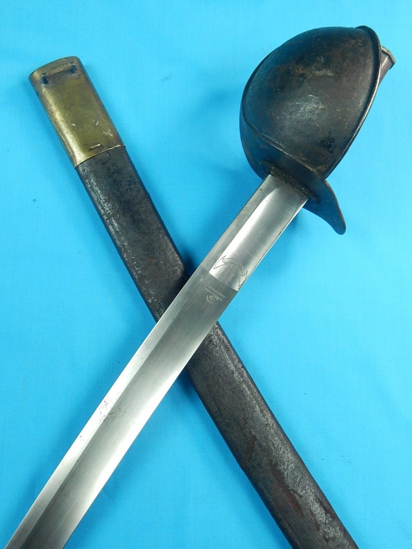 Antique 19 Cent 1865 French France Navy Cutlass Sword: NO BUYER"S PREMIUM! (BUYER"S PREMIUM 0%).Original Antique 19 Century 1865 Dated French Navy Cutlass Sword with Original Scabbard. 32" total length. The blade is 26 1/2".We accept payment by check or m