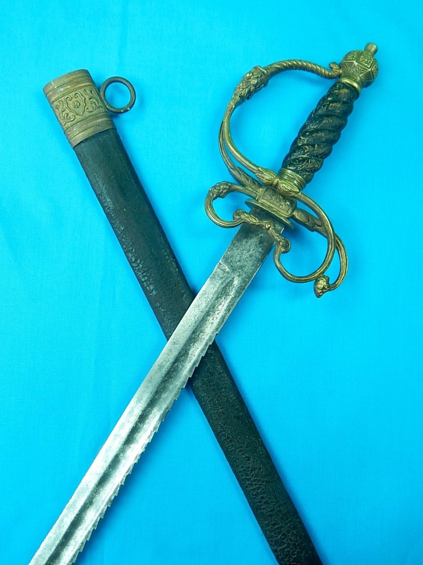 German Austrian WW1 Fireman Saw Back Short Sword Dagger: NO BUYER"S PREMIUM! (BUYER"S PREMIUM 0%). Original German or Austrian WW1 Fireman Saw Back Short Sword with Scabbard.28 1/4" total length. The blade is 22 1/2". We accept payment by check or money ord