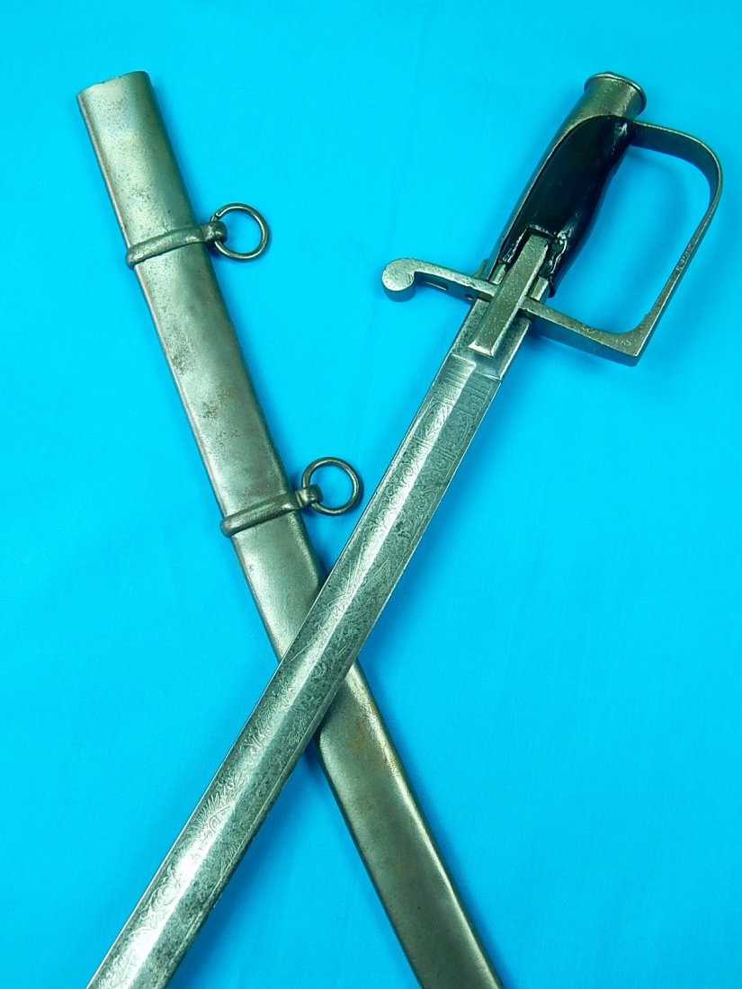 Italian Italy Antique 19 Century Engraved Cavalry Sword: NO BUYER"S PREMIUM! (BUYER"S PREMIUM 0%).Italian Antique 19 Century Engraved Cavalry Sword with Scabbard. Maker marked under the guard. Size: 35 7/8" long with 30 3/4" blade.We accept payment by check