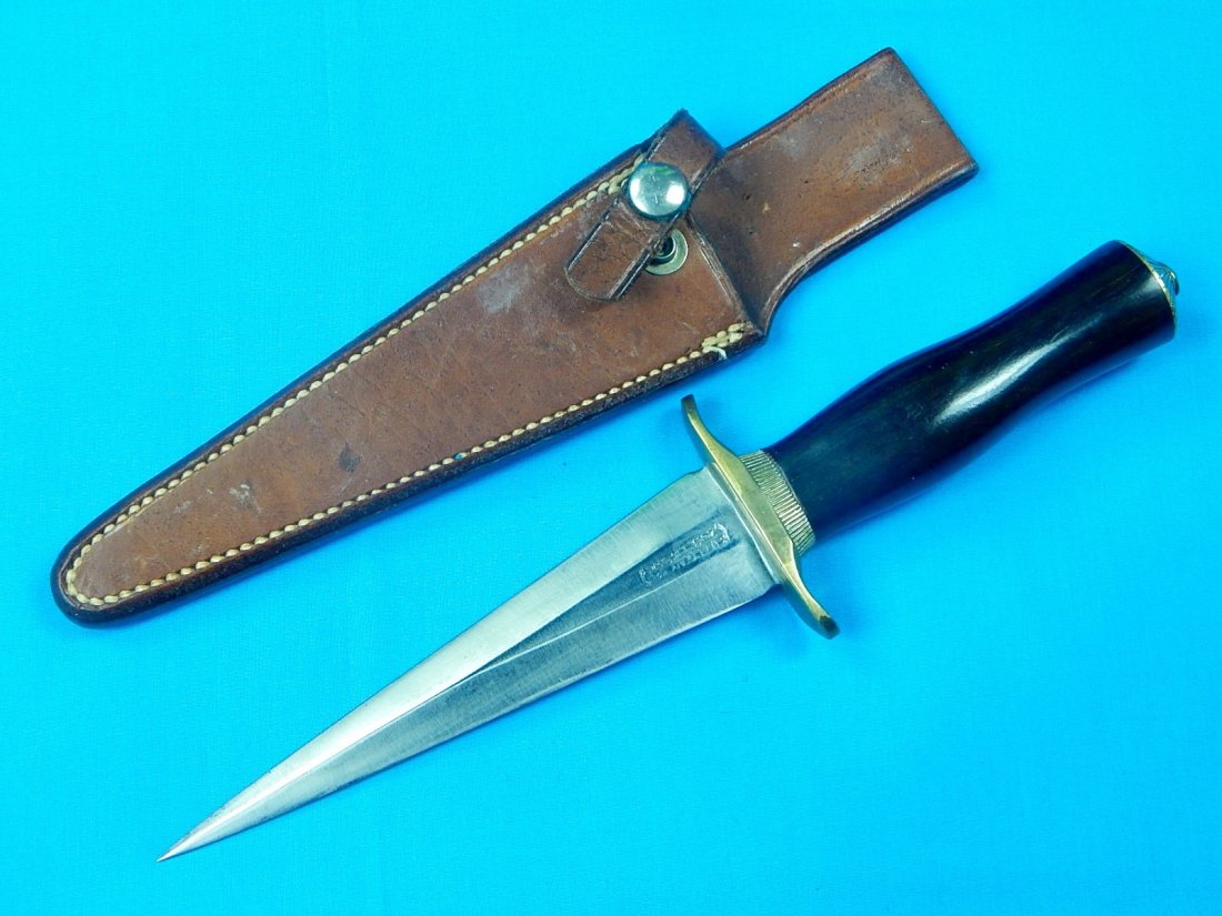 Vintage US Custom Hand Made RANDALL Fighting Knife: NO BUYER"S PREMIUM! (BUYER"S PREMIUM 0%).Vintage US Custom Hand Made RANDALL Orlando FL Fighting Knife with Leather Sheath. Size: 10 3/4" long with 6" blade.We accept payment by check or money orders.