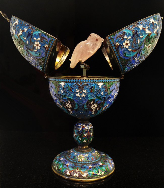 RUSSIAN LARGE SILVER ENAMEL EGG WITH QUARTZ OWL: Blue, Rose, and Green Enamel Egg with Sterling Silver Base. Egg opens up to reveal Rose Quartz perched Owl. 88 Silver Purity Mark, Imperial Warrant Mark, and Town Hall Marks. Height: 7.5 inches weight