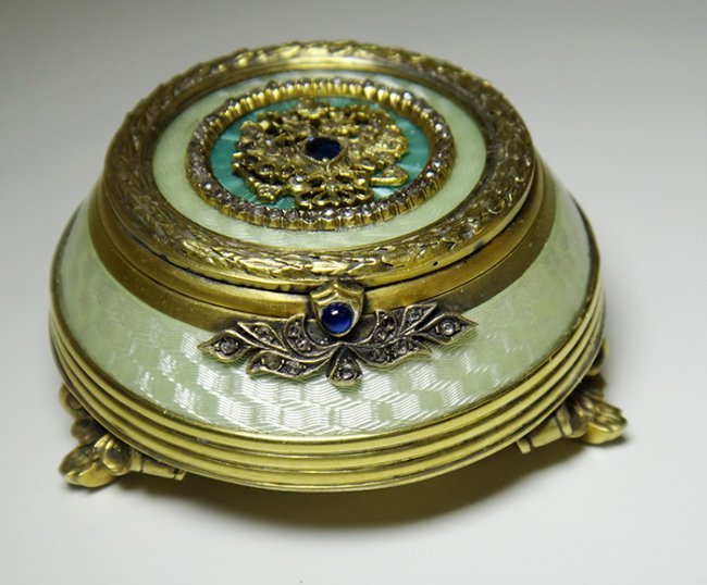 RUSSIAN SILVER GUILLOCHE AND GOLD GILT BOX: Russian silver enamel box Round Lidded shape with Double Eagle Seal on Top of Lid. 88 Silver Purity Mark, Maker's Mark H.W. and Town Hall Mark comes with Wood Presentation Box. height: 30.97mmweight :
