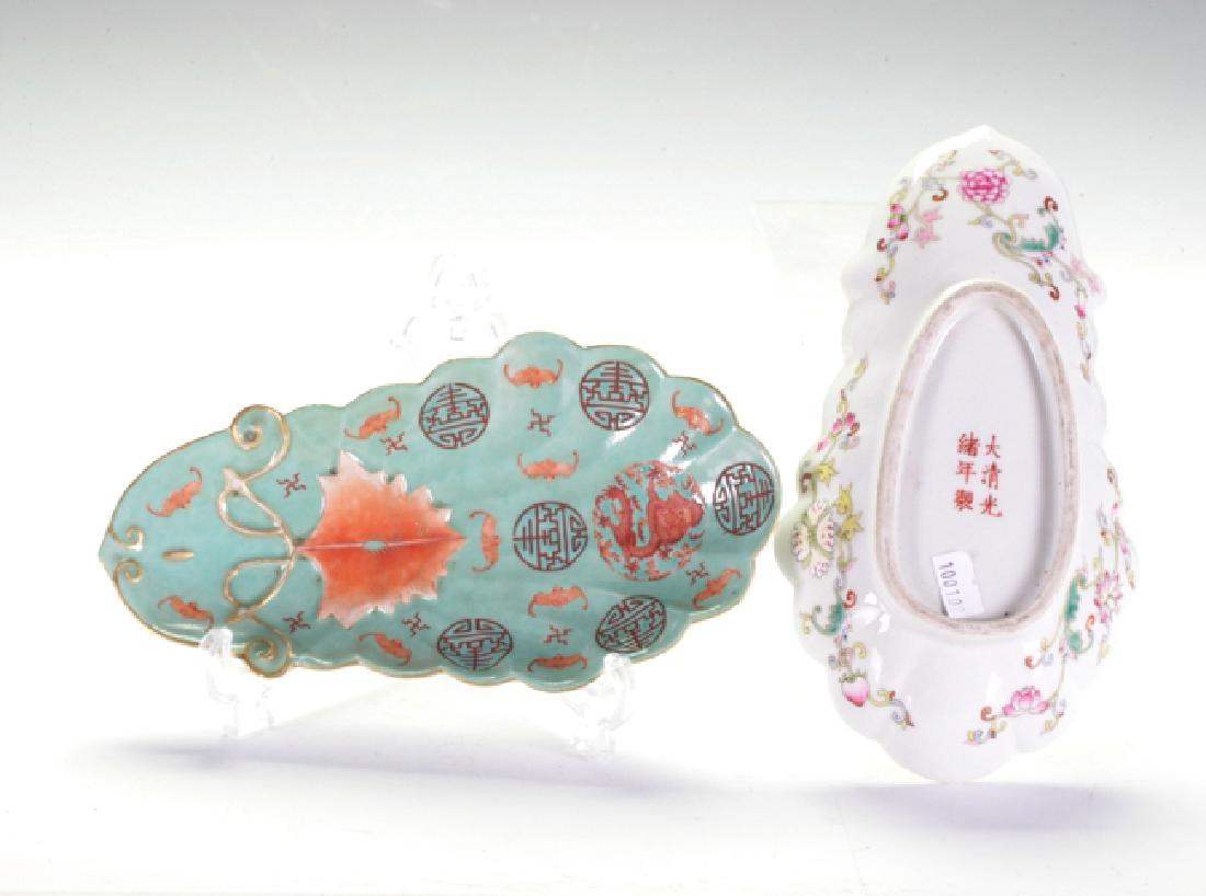 A Pair Of Dishes: Presented with orange dragons, bats and Chou characters on a green glaze background. Along with a unique weaved rim. Guang Xu mark on the base of the dishes, late 19th century. 22cm length.