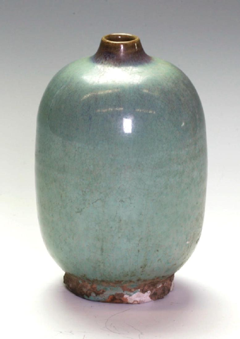 Beautiful Jung-Ware Bottle Vase: Sky blue glazing with purple tinge. Very narrow neck with brown coloring. The bottom is in natural form without glazing. 16cm height.