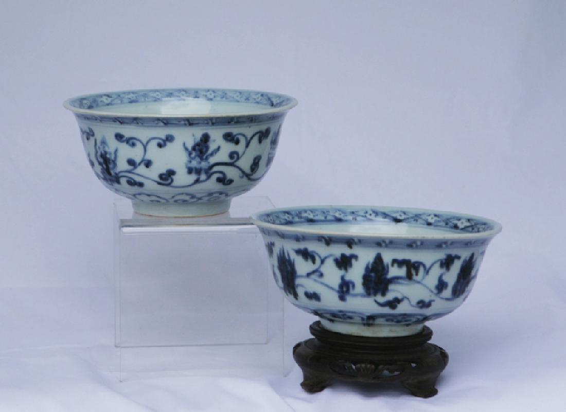 A Pair Of Blue And White Bowls: Ming Dynasty. Decorated all over with stylised flowers and plants. 14cm diameter; 6cm high.