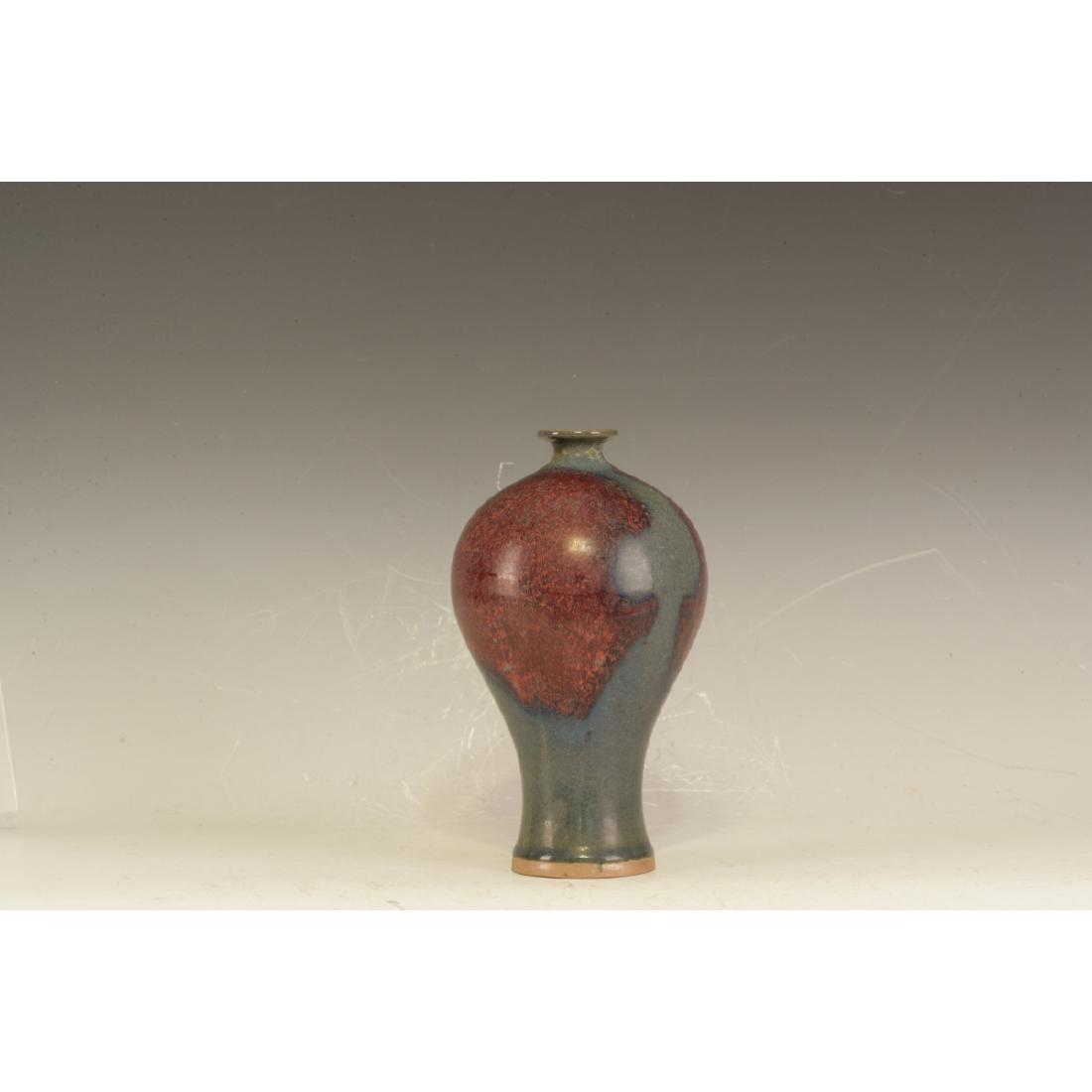 A Jun Ware Vase: Meiping shape. Sky blue glazing with burning red. Very lovely shape. Height 21.5 cm