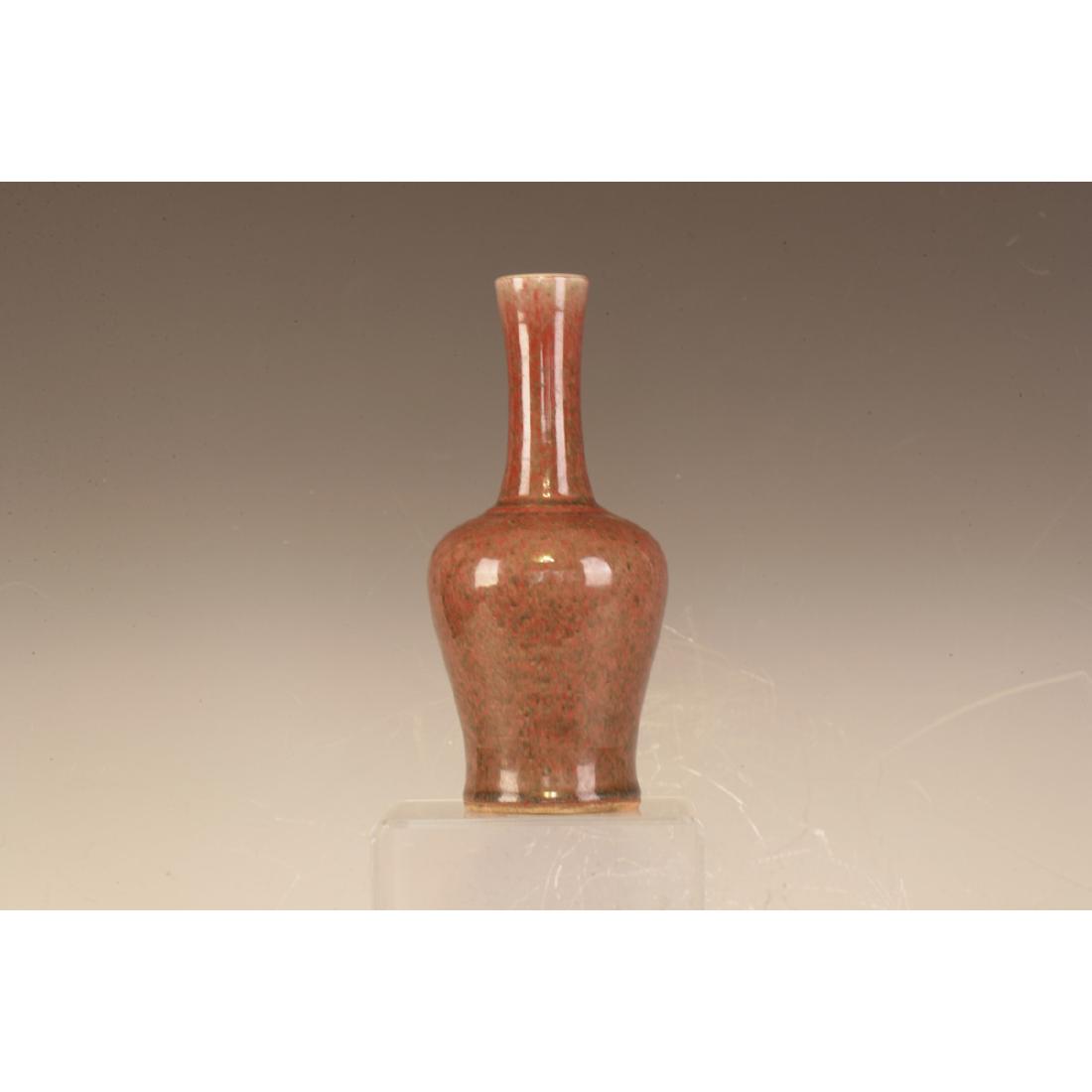 A Jun Ware Vase: Long neck and Ovel body with reddish glazing. Very unique shape. Height 23cm