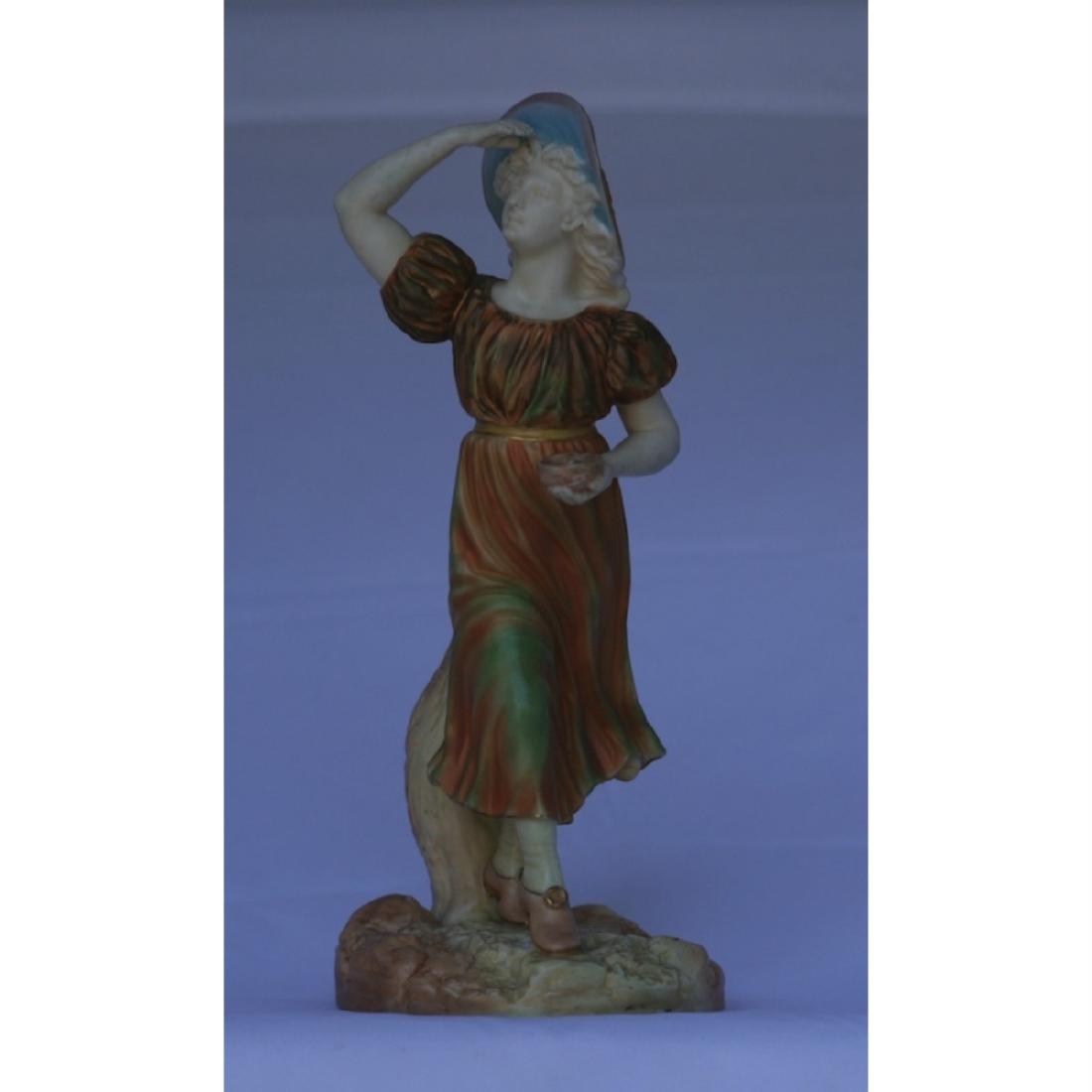 Royal Worcester Figure: In gold colour. 19th century. Puce mark. 23cm high.