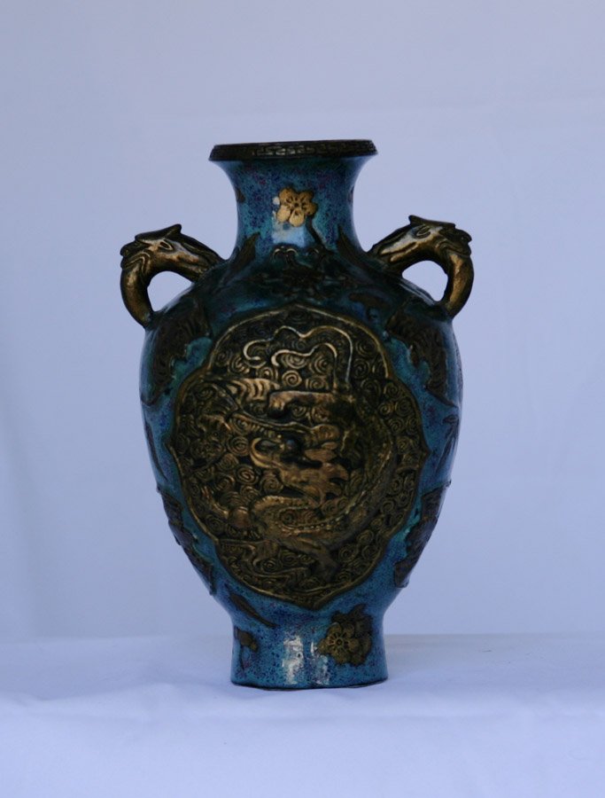 A ceramic jing ware vase: Golden handles. Highly decorated with golden dragon and bat decorations on front and back. Impressed gold Qianlong mark to base. 19cm high; 11cm wide.m