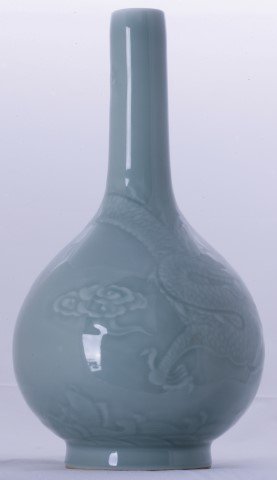 An Oval Body Vase: Powder green glaze and decorated with dragon pattern. Six Chinese character marks on the base. 29cm high