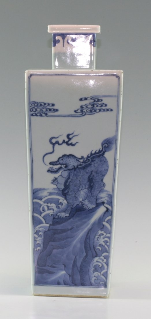 Blue and White Rectangular Vase: Painting of Qi Ling animal standing on a rock near the sea. Four side panel. Kang Xi mark on the base. 43.5cm height.
