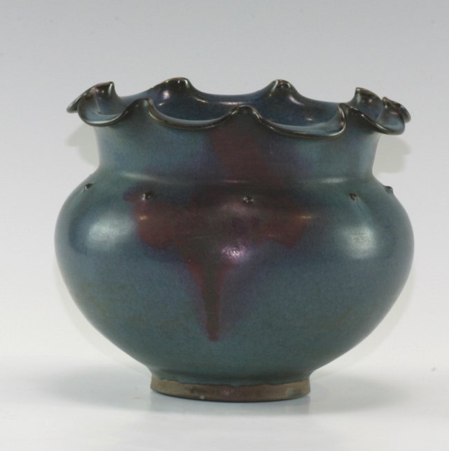 Flambe Vase: Very unusual weaved rim. In think pard blue glaze with ox blood red drop. Globe shaped body. 19cm height, 20cm diameter.