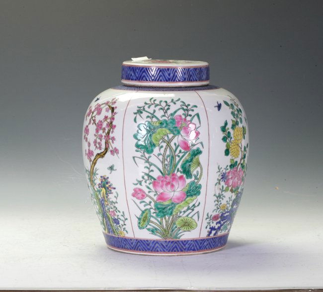 Famille Rose Covered Ginger Jar: Presented with panels of flowers from different seasons all around in multi-color. Kang Xi mark on the base. 28.5cm height.