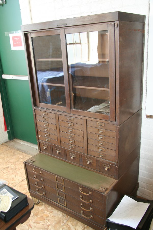 Metal Filing Cabinet with Glass Doors: Metal filing cabinet, glass doors, comes in three sections