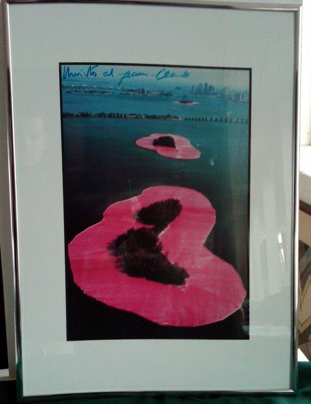 Christo and Jeanne Claude Signed Photo: Christo and Jeanne Claude signed photo, Surrounded Islands, Miami, Florida 1980-83, Photo: Wolfgang Volz, ht. 17, wd. 12, ht. 24 1/4, wd. 18 1/4.