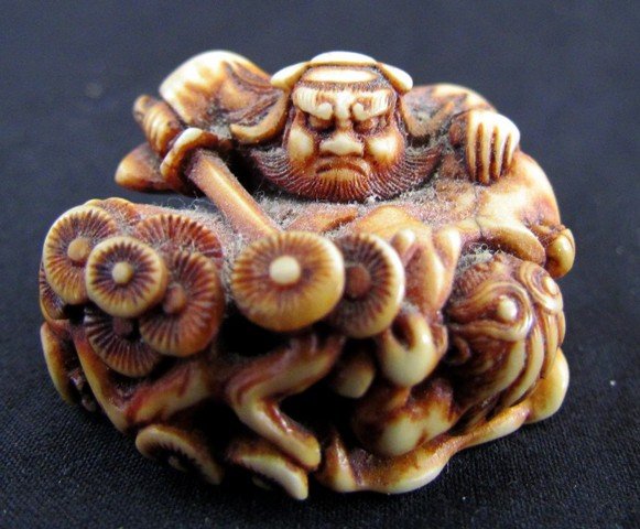 Antiqe Oriental Carved Ivory Netsuke: Antique Oriental Carved Ivory Netsuke, man with sword, ht. 1, wd. 1 1/2