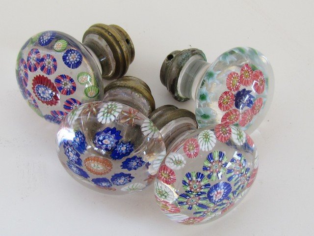 Set of Four Paperweight Doorknobs: Set of 4 Colorless Glass Paperweight Doorknobs in the Millefiori Pattern measuring 2 inches wide by 2 inches high.