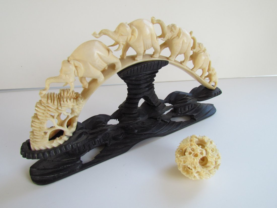 Two Carved Chinese Items: Two carved chinese ivory items, elephant bridge, wd. 9, puzzle ball diam. 1 1/2